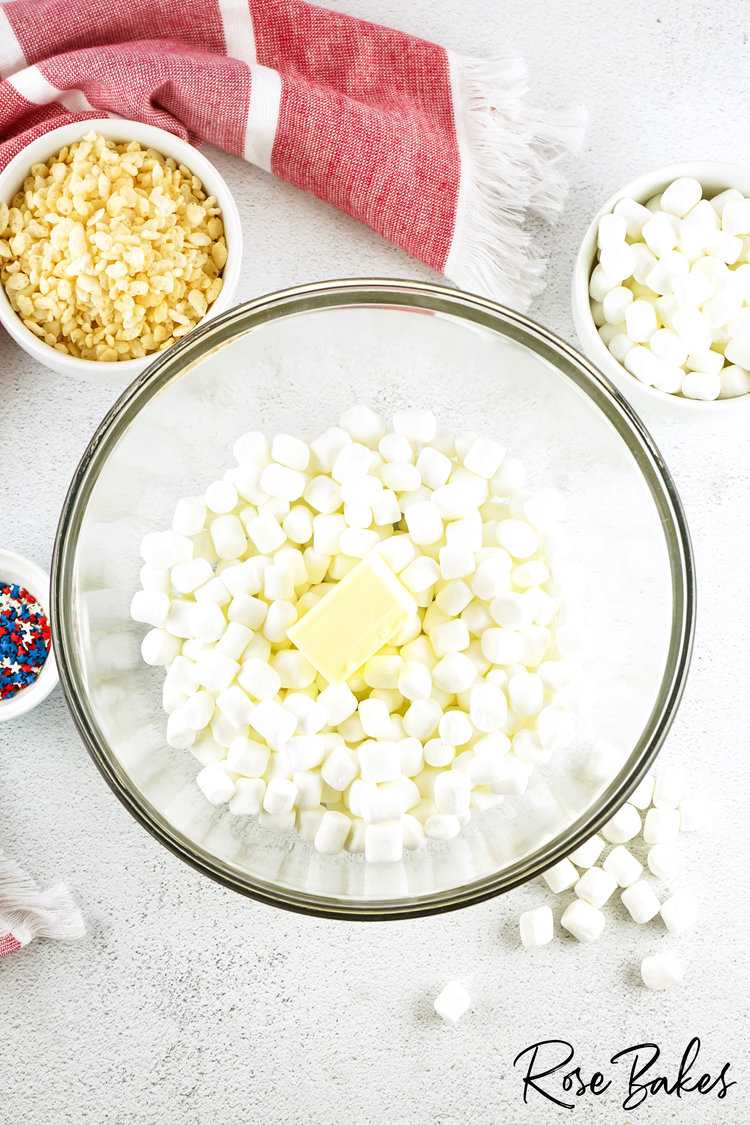 marshmallows and butter in a clear bowl